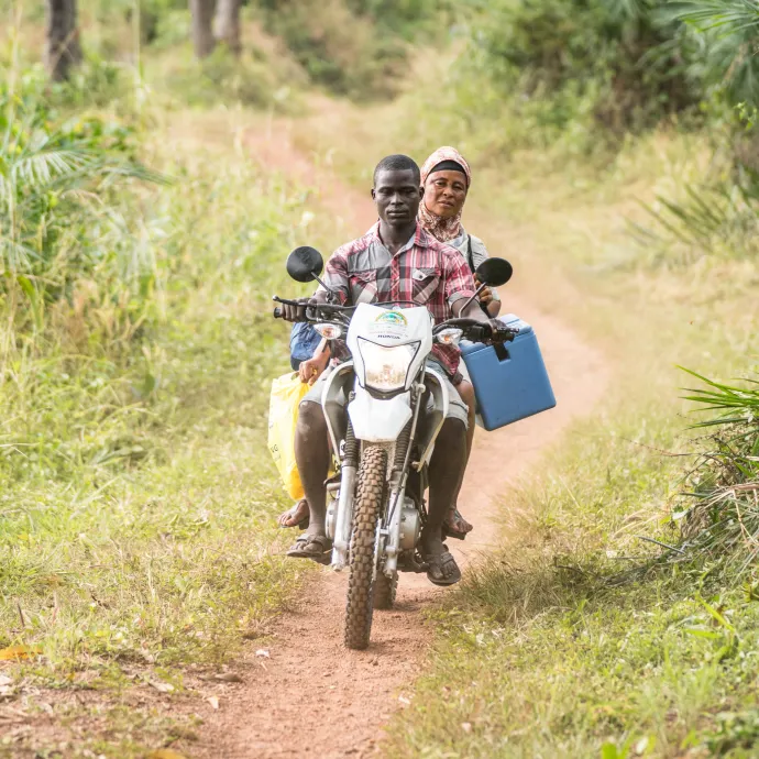 Nurse Kai bundles her vaccines via local motorbike taxi to access hard-to-reach communities as part of the mobile COVID-19 vaccination team.